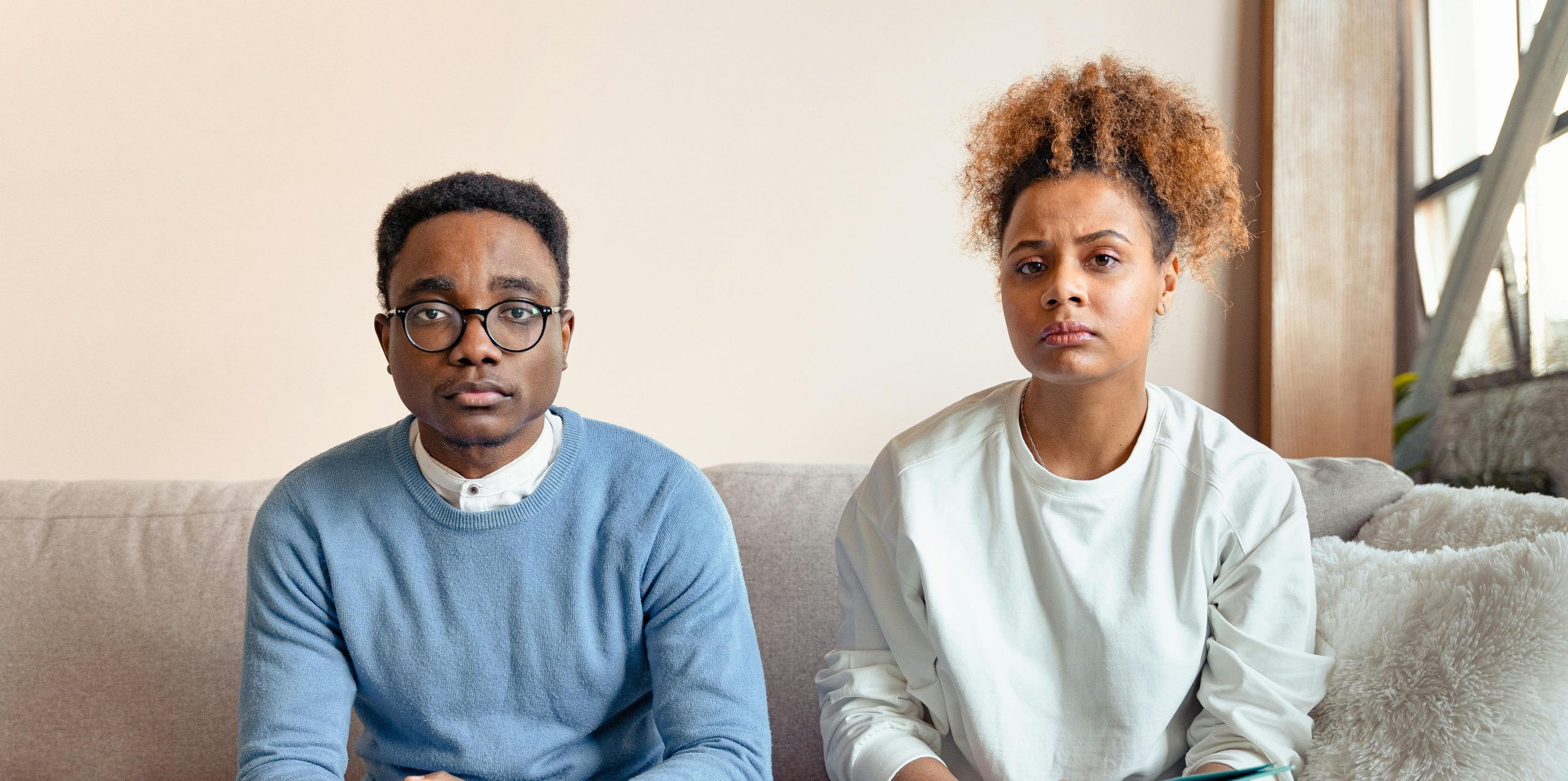 Couple struggling with disagreement and a lack of support during an unexpected pregnancy.